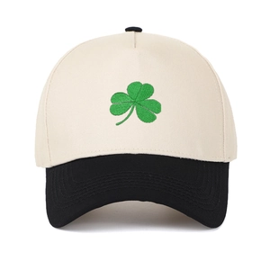 Classic two-tone baseball cap with cream crown, black brim and green clover embroidery
