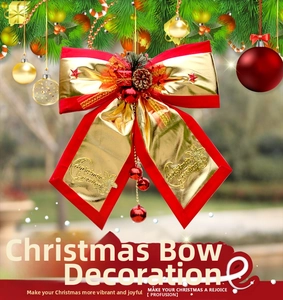 Christmas bow ornament with pine cones and berries on a festive evergreen branch