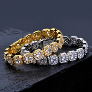 Detailed close-up of gold and silver plated hip-hop bracelets with square-cut cubic zirconia