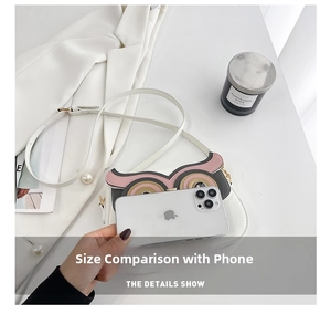 Mini owl shoulder bag in white PU leather shown next to a smartphone for size comparison