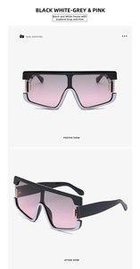 Dettaglio occhiali da sole oversize bianchi e neri con lenti sfumate grigio rosa