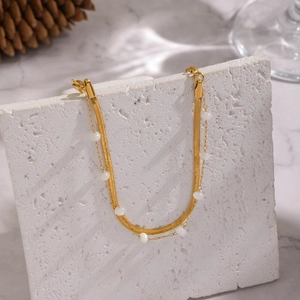 Double-layered 18K gold plated flat snake chain bracelet with elegant white pearls