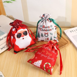 Three assorted Christmas polyester drawstring gift bags with Santa and festive patterns