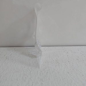 Close-up of a clear plastic packaging bag with a hanging hole for Christmas ornaments