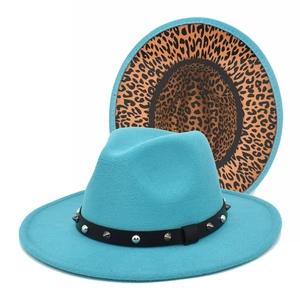 Detail of teal fedora hat with leopard print lining and studded black leather band