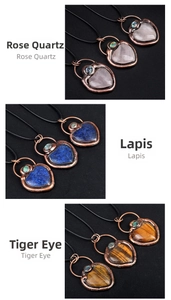 Detailed heart pendants in rose quartz, lapis lazuli, and tiger eye with bronze alloy edges