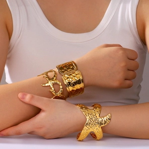 Bohemian gold plated stainless steel open bangles with starfish and textured hammered finish
