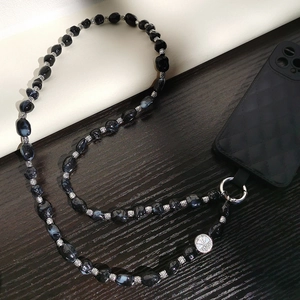 Ethnic irregular black marbled bead phone strap with silver metal beads and round charm