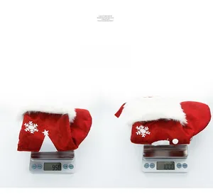 Detail view of red knitted Christmas stocking weight measurement on electronic scale