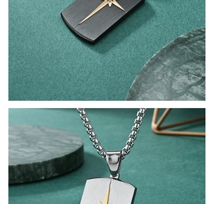Detail view of silver brushed rectangular pendant with golden star and inset diamond