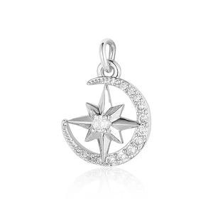 Close-up of silver crescent moon and star pendant with sparkling cubic zirconia stones
