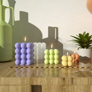 Collezione di candele bubble in vari colori e dimensioni per l'arredo casa