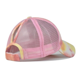 Detail of ponytail hole and breathable mesh back on tie-dye sun visor baseball cap