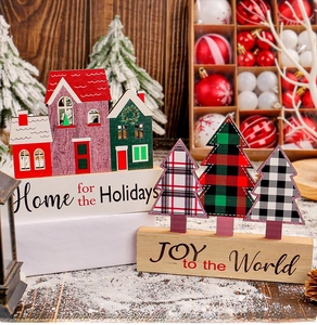 Detailed view of wooden Christmas house ornaments with JOY to the World hand lettering