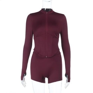 Women's burgundy yoga set with zip-front long sleeve top and slim fit shorts
