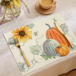 Close-up of fall placemat with sunflower and pumpkin prints on a linen texture