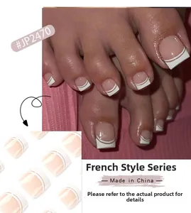 Detail view of French style press-on toenails in nude pink with white double-line tips