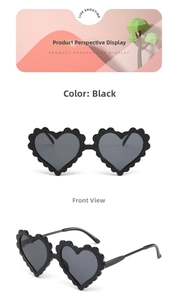 Detail view showing front and side angles of black heart-shaped sunglasses with wavy edges