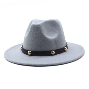 Detail of grey wool fedora hat featuring a black band with gold spherical metal studs