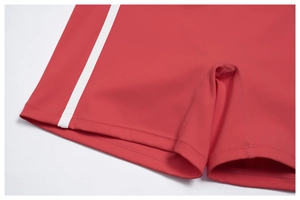 Detail of red yoga shorts showing high-stretch fabric and reinforced gusset stitching