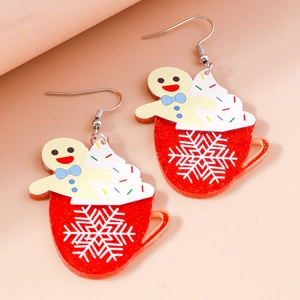 Detail of gingerbread man and red snowflake cup acrylic Christmas dangle earrings