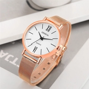 Close-up of rose gold Geneva quartz watch with mesh strap and elegant Roman numeral dial