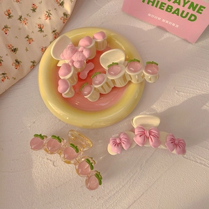 Sweet pink peach and bear hair claws set in resin with heart and bow designs