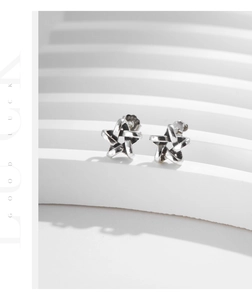 Detail view of S925 sterling silver star earring with woven texture and material stamp
