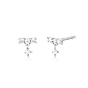 Macro detail of silver drop earrings featuring marquise accents and small crystals