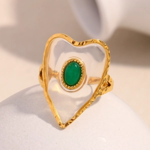 Detail showing 18K gold plated steel ring with green heart acrylic and hammered texture