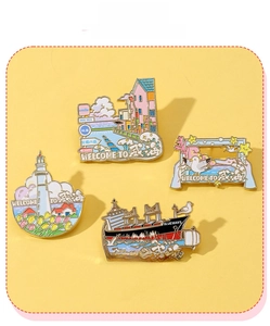 Detail view of four Weihai metal souvenir pins featuring lighthouse and sea elements
