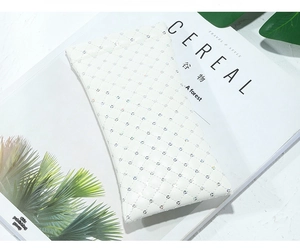 Detail of white quilted PU leather sunglasses pouch with sparkling rhinestone embellishments