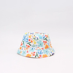 Detailed view of kids floral bucket hat with orange and yellow flower pattern on white base