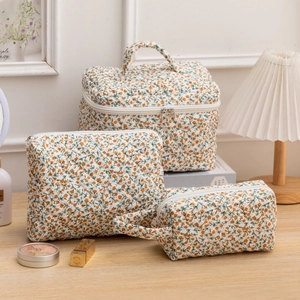 Three-piece set of floral quilted makeup bags with large handle bag and zipper pouches