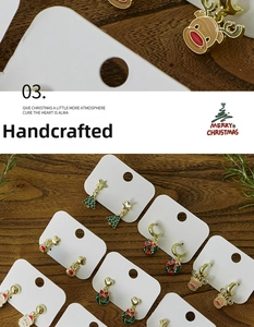Detailed macro view of enamel Christmas earrings featuring Santa and reindeer designs