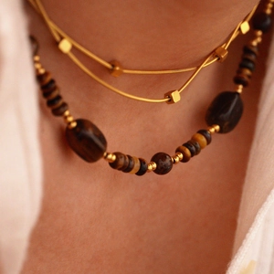 Double-layered 14K gold stainless steel necklace with sun pendant and tiger eye beads