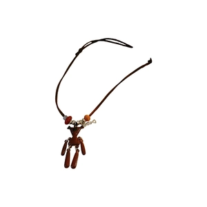 Retro brown bear pendant necklace with glossy finish and colorful beads on a cord