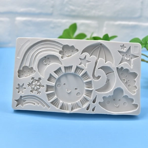 Grey silicone mold with sun, rainbow, and moon shapes for fondant cake decoration