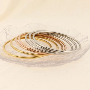 Polished stainless steel 3mm stackable bangles in gold, rose gold and silver set of seven