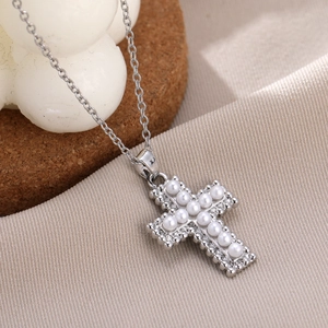 Elegant silver necklace with cross pendant featuring white pearls and tiny zircon stones