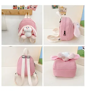 Detail view of pink toddler canvas backpack with long-eared plush bunny decoration