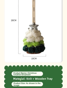 Detailed view of tiered knitted Christmas tree pendant with silver star and wood base