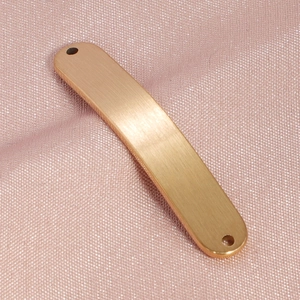 Macro detail of golden brushed titanium steel bar connector for jewelry making