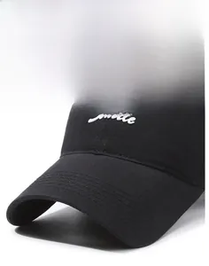 Detail of white Seattle 3D embroidery on a black cotton baseball cap with curved brim