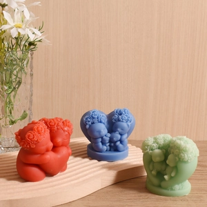 Handmade heart-shaped angel candles with roses on a wave wooden tray for home decor