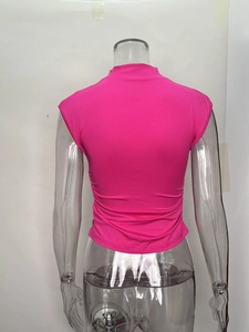 Detail view of pink mock neck sleeveless top featuring elegant ruched back design