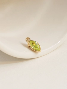 Macro shot of 18K gold-plated marquise lemon green zircon pendant DIY accessory