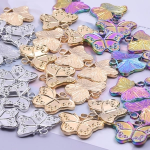 Minimalist stainless steel butterfly pendants in silver, gold, and rainbow finishes