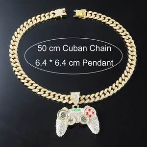 Detailed view of gold cuban chain and gamepad pendant with MW3 logo and micro-pave stones