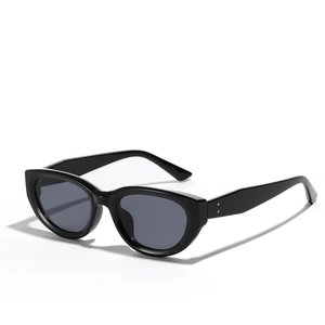 Vintage black cat-eye sunglasses with silver rivet detail and dark grey lenses on white